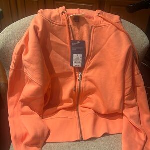 Universal trend cropped salmon colored hoodie